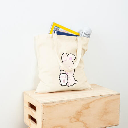 minimal natural beige color tote bag with printed cute soft pink bunny holding a paper coffee cup with pink bunny logo